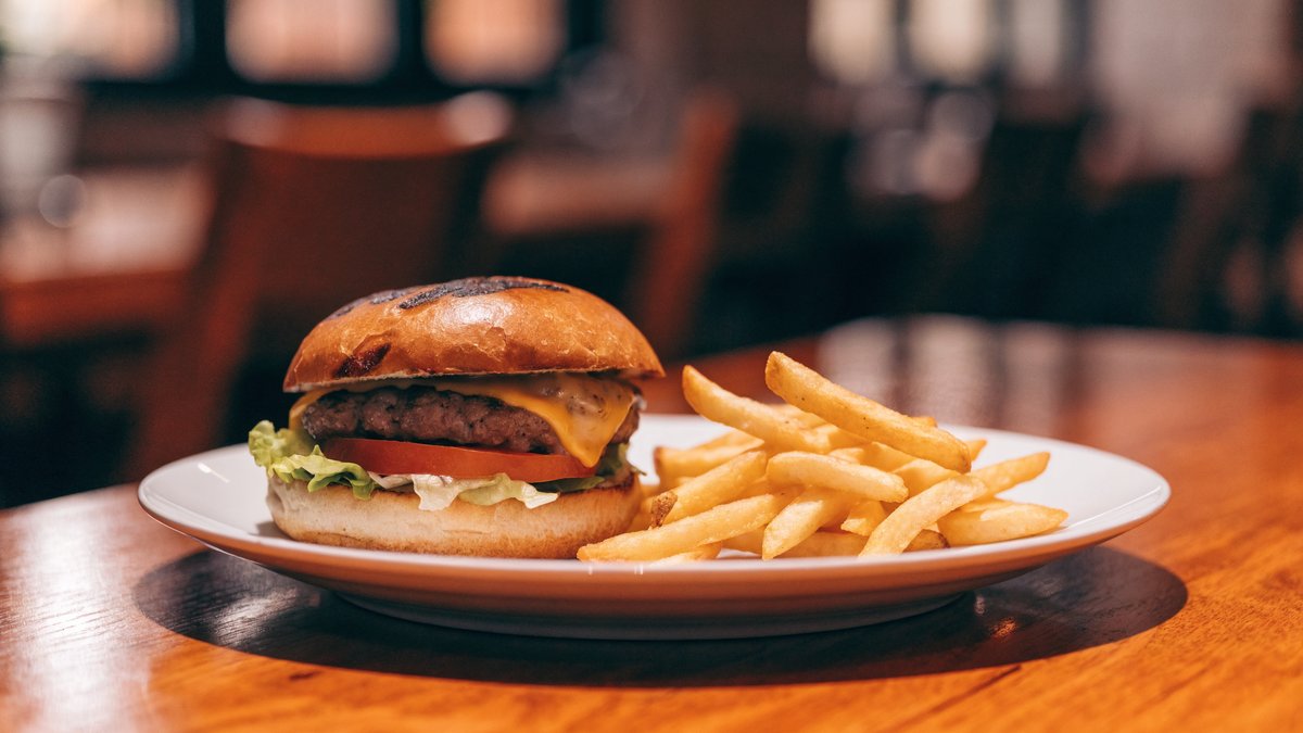 A restaurant burger and fries on a plate